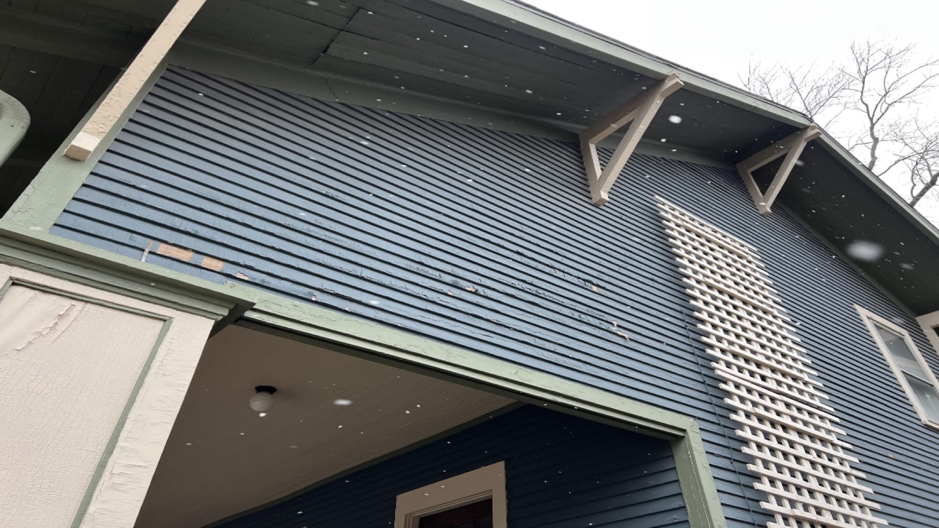 Exterior siding showing cosmetic wear but sound structure