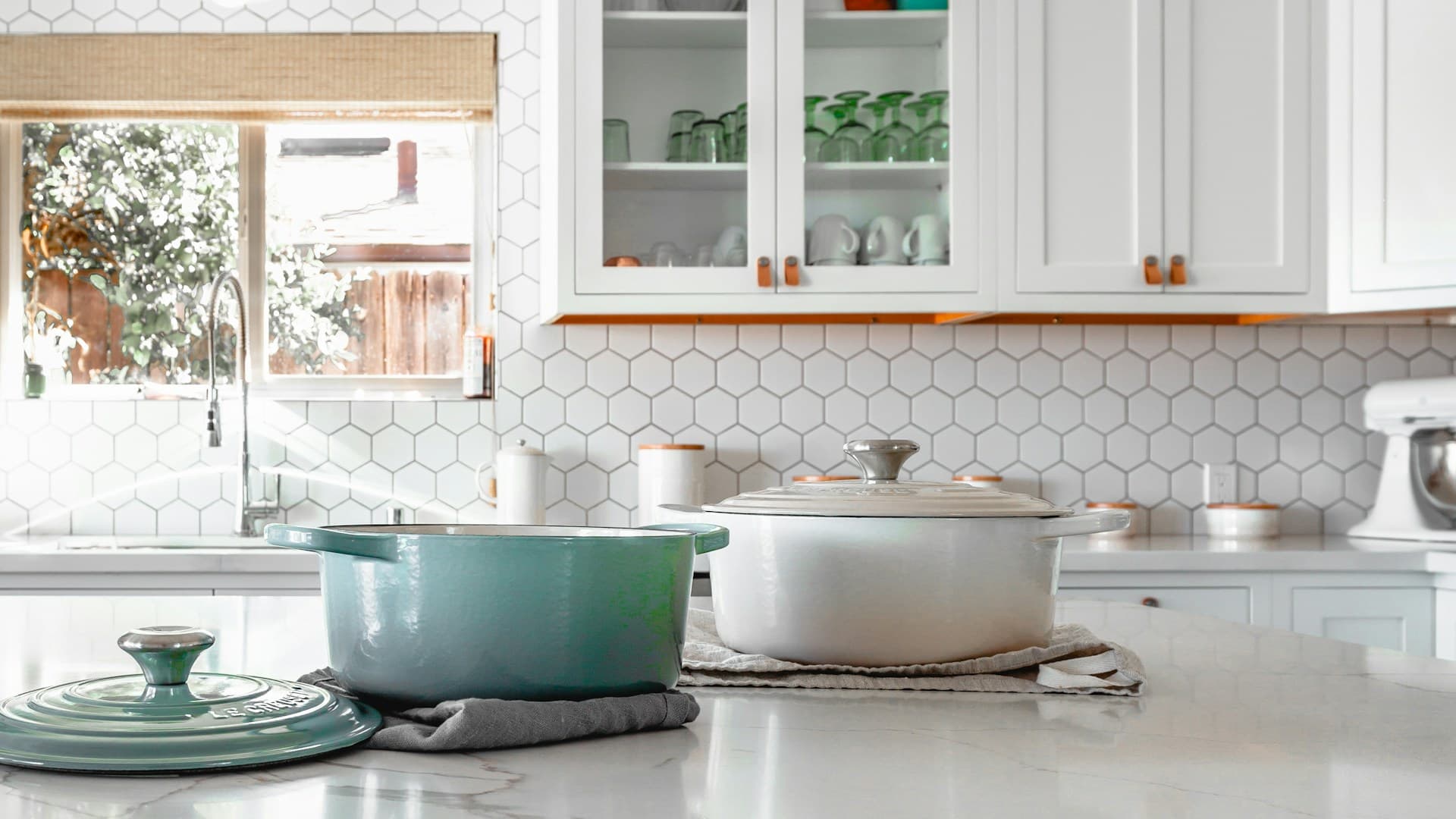 Kitchen island with marble countertop and Wolf range